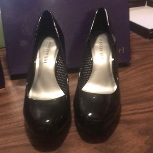 Black patent leather pumps